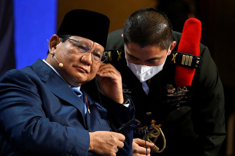 Indonesian Defense Minister Prabowo Subianto speaks with an aide during the second plenary session of the 19th Shangri-La Dialogue in Singapore, June 11, 2022.  Credit: Reuters