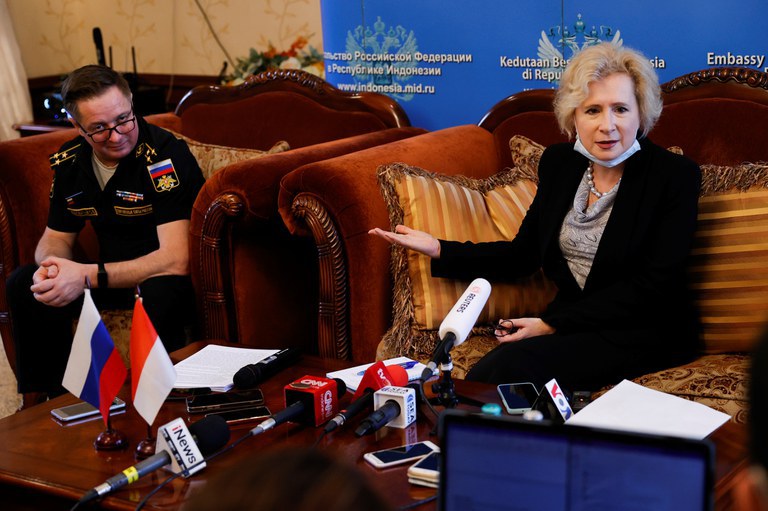 Russian Ambassador to Indonesia Lyudmila Vorobieva gestures while talking to journalists as Defense Attache Sergey Zhevnovatyi listens during a news conference at the Russian Embassy in Jakarta, March 23, 2022. Credit: Reuters