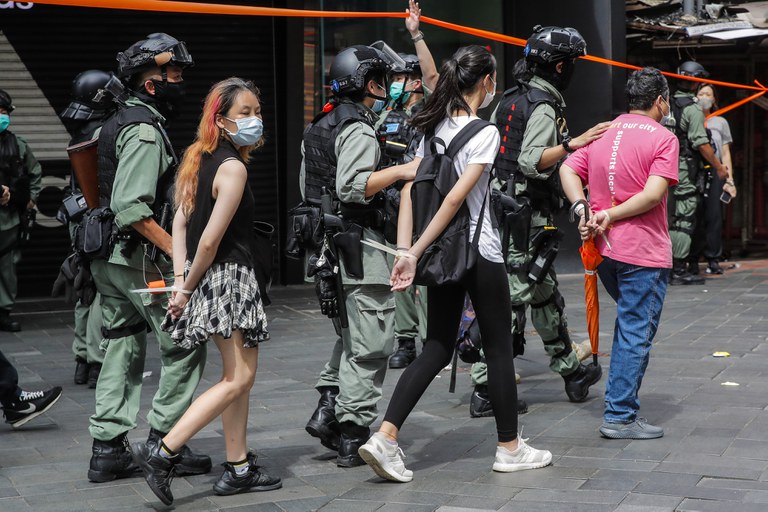 Police detain protesters after a protest in Causeway Bay before the annual handover march in Hong Kong, July 1, 2020. Credit: AP Photo