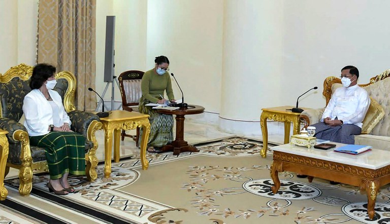 This handout from Myanmar's military information team taken and released on Aug. 17, 2022 shows Myanmar's armed forces chief Snr. Gen. Min Aung Hlaing [right] meeting with United Nations Special Envoy on Myanmar Noeleen Heyzer [left] in Naypyidaw. Credit: Myanmar's Military Information Team/AFP