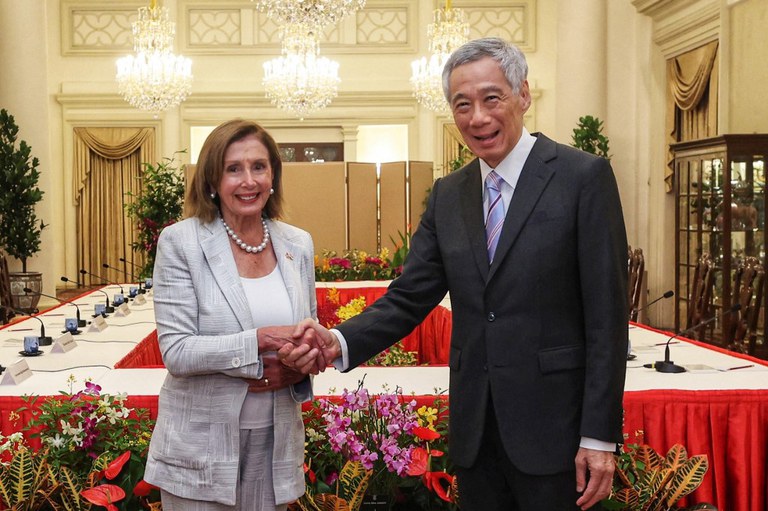Singapore's Prime Minister Lee Hsien Loong (R) shakes hands with U.S. Speaker of the House Nancy Pelosi at the Istana Presidential Palace in Singapore during a visit to the Asia-Pacific region, Aug. 1, 2022. Credit: Singapore's Ministry of Communications and Information / AFP