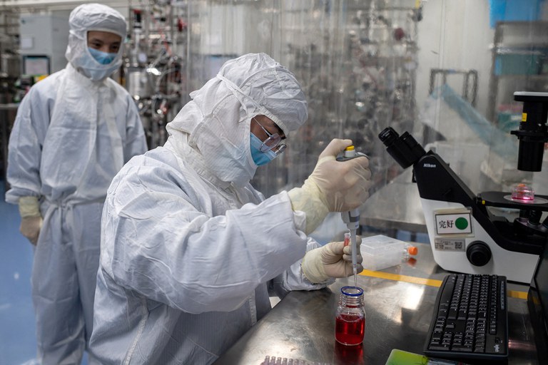 4 engineer takes samples of monkey kidney cells.jpg