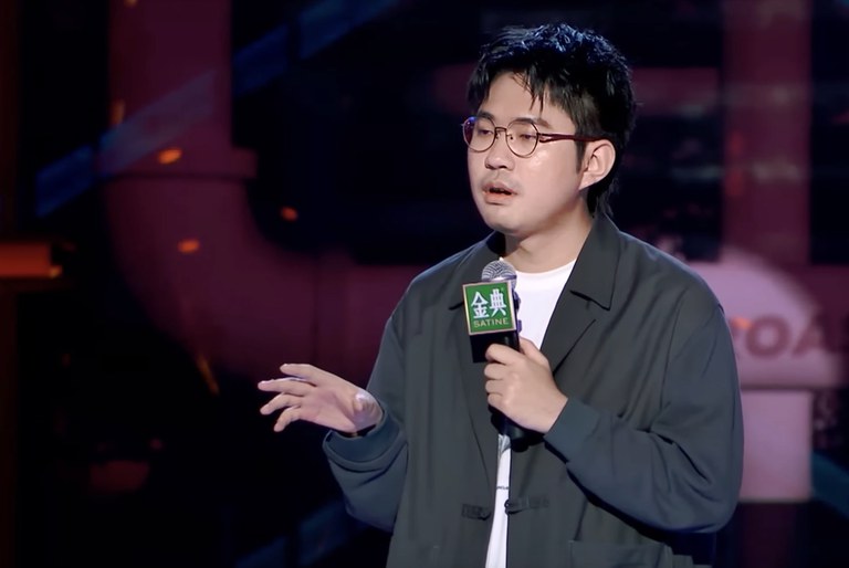 In this undated screenshot, stand-up comic Li Haoshi performs. His employer, a Chinese comedy agency, suspended Li after he sparked public ire with a joke which some said likened feral dogs to soldiers of the People's Liberation Army. Credit: Screenshot from Tencent Video Talk show