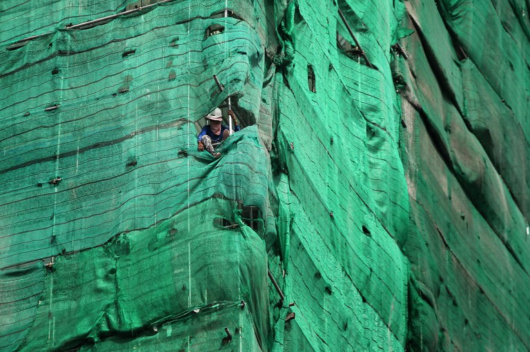 A worker at a construction site in Phnom Penh, Cambodia in 2016. Credit: Samrang Pring/Reuters