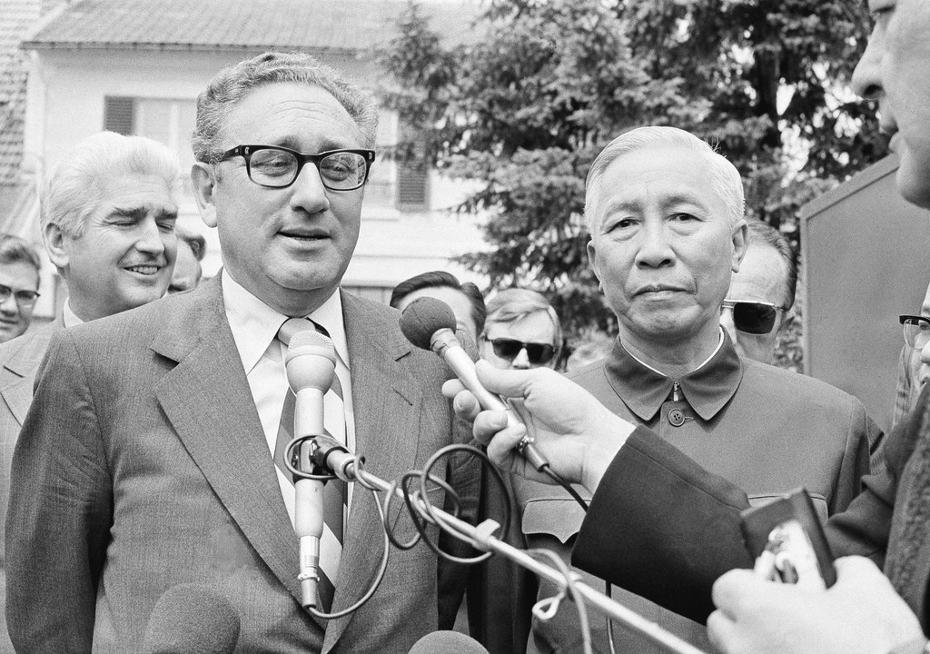 President Nixon's National Security Adviser Henry A. Kissinger and Le Duc Tho, the chief North Vietnamese negotiator at the Paris peace talks, speak to the media in Paris, June 13, 1973. (Michel Lipchitz/AP)