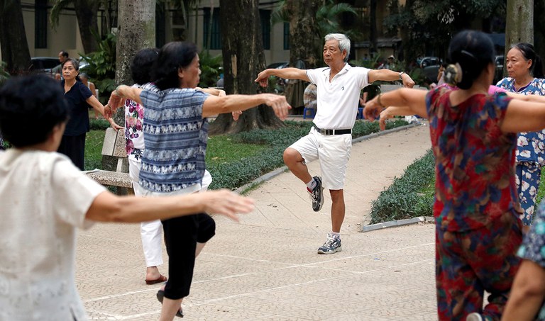 Elderly people exercise at a public park in Hanoi, Oct. 9, 2018. (Kham/Reuters)