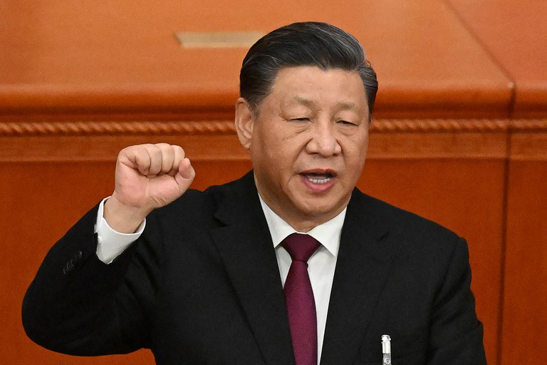 China's President Xi Jinping swears under oath after being re-elected as president for a third term during the third plenary session of the National People's Congress in Beijing, March 10, 2023. (Noel Celis/AFP)