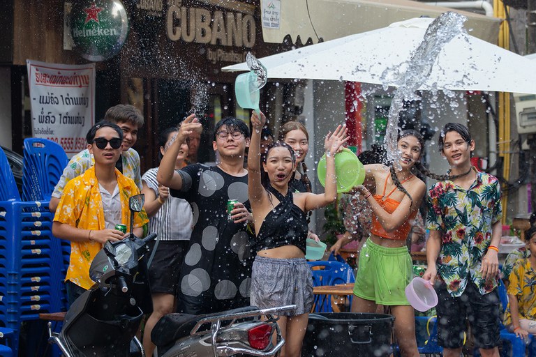 Young people splash water at each other in celebration of the Songkran festival in Vientiane, April 14, 2023. (Kaikeo Saiyasane/Xinhua via Getty Images)