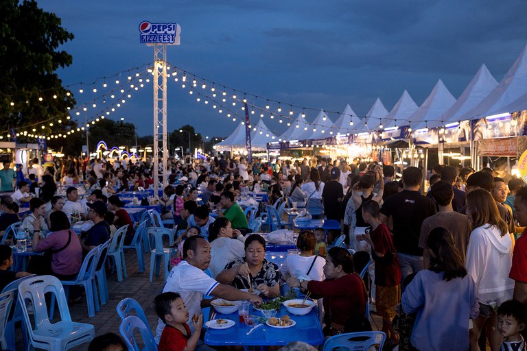 People eat at a night market in Vientiane, Oct.  28, 2023. (Jack Taylor/AFP)