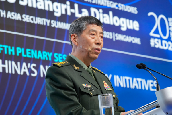 China's then-Minister of National Defence Li Shangfu salutes the audience before delivering a speech during the 20th Shangri-La Dialogue summit in Singapore on June 4, 2023