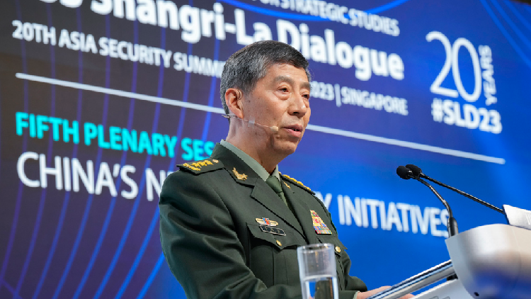 China's then-Minister of National Defence Li Shangfu salutes the audience before delivering a speech during the 20th Shangri-La Dialogue summit in Singapore on June 4, 2023