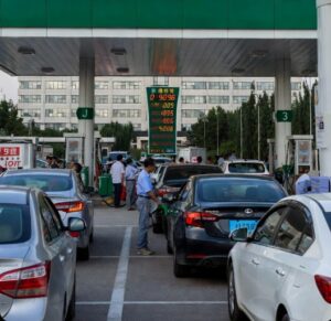 Despite huge petroleum reserves and discounted Iranian crude, China hiked retail fuel prices sharply in March 2026 amid soaring global oil from the Iran conflict. Explore the reasons and impacts.